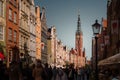 People on Dlugi Targ street in Gdansk. View of the Town Hall Tower