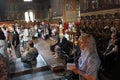 People do rituals on a holy mass in St. Sedmochislenitsi church in Sofia, Bulgaria on july 27, 2012