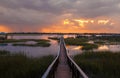 People on dock at sunset Royalty Free Stock Photo