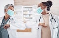 People, doctor and face mask in elbow greeting, meeting or handshake in social distancing at hospital. Women, medical or Royalty Free Stock Photo