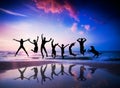 People and dog jumping on beach Royalty Free Stock Photo