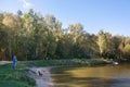 People, dogs, trees and pond 20.09.2018