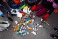 People doing a beach clean-up, community initiative to gather trash