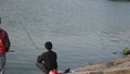 People doing fishing activity near Cengklik Reservoir in Boyolali, Central Java, Indonesia