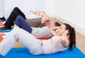 People doing sit ups at gym Royalty Free Stock Photo