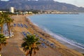 During sunrise, Group of people practising yoga on Altea beach, Alicante,Spain