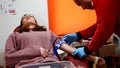 People donate blood to the Red Crescent blood bank in order to help the injured people in the earthquake area in Turkey