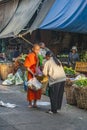 people donate food to the monk