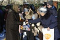 People donating money for Orthodox church, xchurch worker taking it