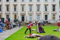 People dress up in medieval clothes doing performance in front of The British Museum