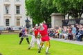 People dress up in medieval clothes doing performance in front of The British Museum