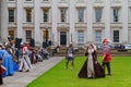 People dress up in medieval clothes doing performance in front of The British Museum