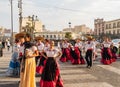 People dress up in traditional clothes parade in the street