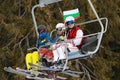 People dressed with traditional Bulgarian clothes skiing with the Bulgarian national flag. Royalty Free Stock Photo