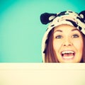 Happy crazy woman in cow costume holding board Royalty Free Stock Photo