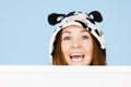 Happy crazy woman in cow costume holding board Royalty Free Stock Photo