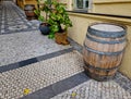 people drink from old barrique barrels in front of the restaurant.