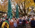 People drink outside at Viktualien Markt beer garden in Munich G