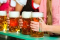 People drinking beer in Bavarian pub