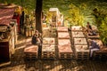 People drinking at an outside bar in the autumn sun on the banks of the river Seine in Paris, France