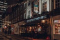 People drinking outside The Two Brewers Greene King pub in Covent Garden, London, UK