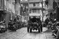 People Driving in the Rain in Kathmandu Patan Durbar Marg