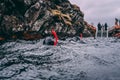 People snorkeling and diving in Blue crystal clear glacial water in Silfra Thingvellir national park Iceland Royalty Free Stock Photo