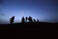 People on dunes of Moroccan desert