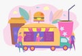 People eat burgers and hot dogs on the street. Fast food on wheels. Street food, urban food truck, festival street food concept. Royalty Free Stock Photo