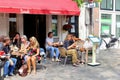 People eat drink Spanish cafe restaurant outdoor terrace, Jordaan Amsterdam, Netherlands