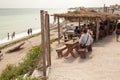 People eating on a beach restaurant