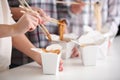 People eating chinese noodles from takeaway boxes, closeup Royalty Free Stock Photo