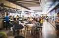 People eating and drinking in food court in Shopping Mall at Sukhumvit road Onnut Prakanong Bangkok Thailand Royalty Free Stock Photo