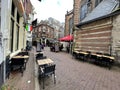 People eating, drinking and gathering in the vibrant cafes, pubs and restaurants of Amsterdam Royalty Free Stock Photo