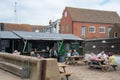 People eating at fast fish food traditional local restaurant in Whitstable Harbour united Kingdom.