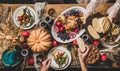 People eating festive dinner with roasted chicken on Thanksgiving day Royalty Free Stock Photo