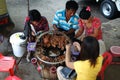 People eating popular street food of animal giblet, Myanmar