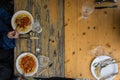 People Eating Simple Cheap Meal Wooden Table Outdoors