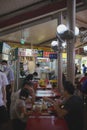 People eating at the Singapore Hawker Adam food center