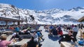 People eating on a ski restaurant over Engelberg on the Swiss alps