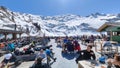 People eating on a ski restaurant over Engelberg on the Swiss alps