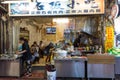 People eating at a small restaurant in Wulai