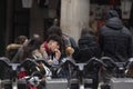 People eating squid sandwiches, Madrid, Spain