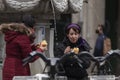 People eating squid sandwiches, Madrid, Spain