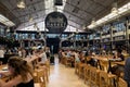 People eating at Timeout market in Mercado da Ribeira hall in Lisbon Royalty Free Stock Photo