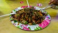 People eating Yong Tau Foo or Yentafu, a Chinese cuisine using plastic fork on a table Royalty Free Stock Photo