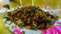 People eating Yong Tau Foo or Yentafu, a Chinese cuisine using plastic fork on a table Royalty Free Stock Photo