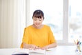 Happy asian young woman student learning at home Royalty Free Stock Photo