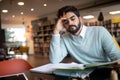 People, education, studying, exams and school concept - tired student learning in library Royalty Free Stock Photo