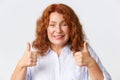 People, emotions and lifestyle concept. Close-up of supportive mother with red hair showing thumbs-up, encourage child Royalty Free Stock Photo